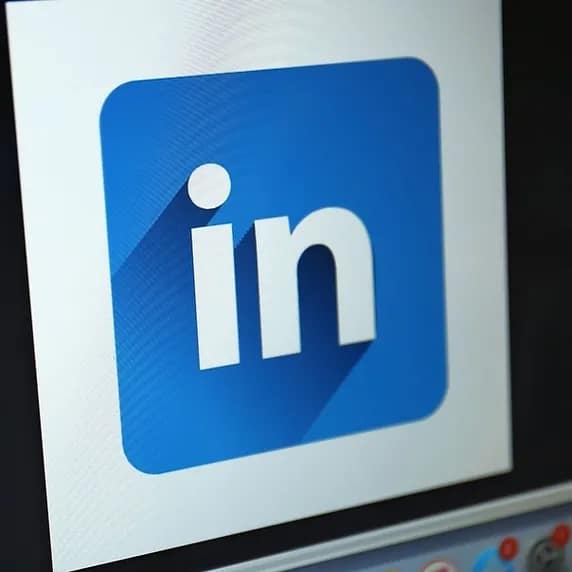 A LinkedIn icon on a screen.
