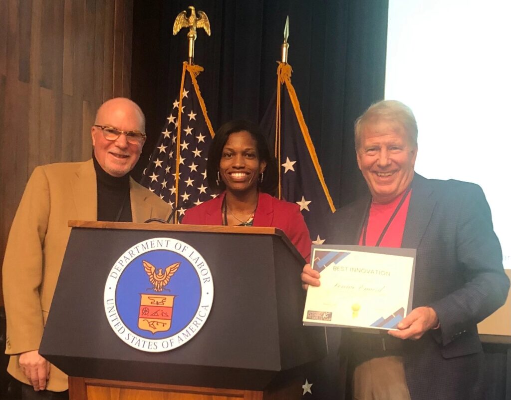 USDOL Recognizes Arkansas’s Leadership in Developing Successful Registered Apprenticeship Programs. Three people standing behind a podium that says "Department of Labor."