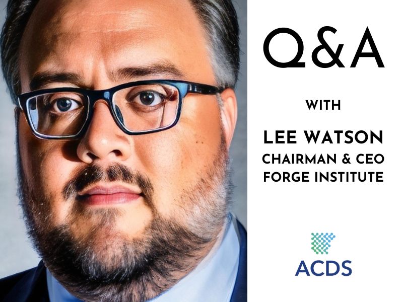 A headshot of Lee Watson, a tan man with salt and pepper hair and beard with glasses. An announcement for his Q&A is beside his photo.