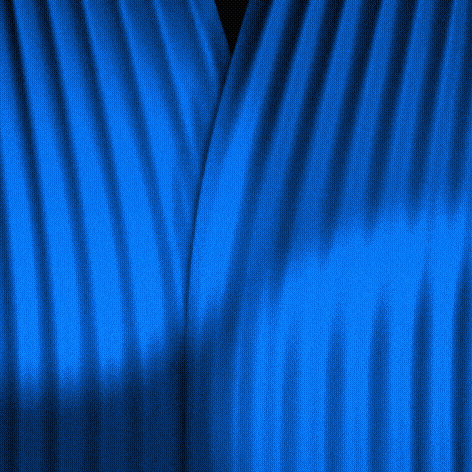 A motion graphic of blue curtains sweeping aside to reveal a black sky of stars. A few gold stars revolve in the middle and eventually form a vertical line.